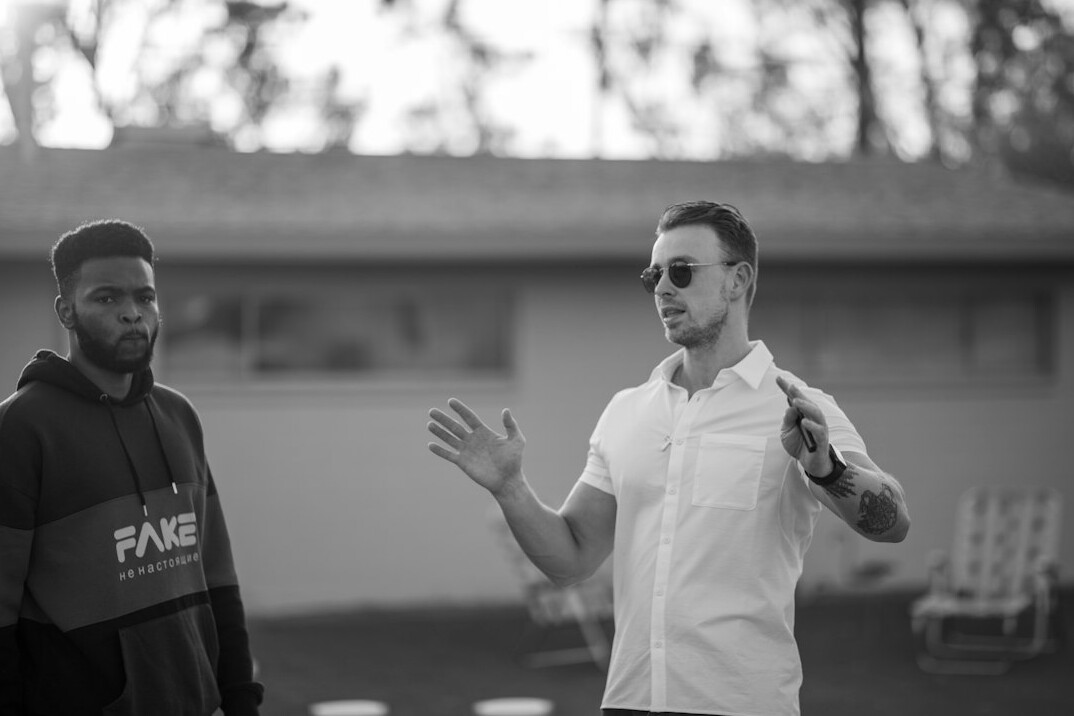 Coach guiding a television presenter before a broadcast
